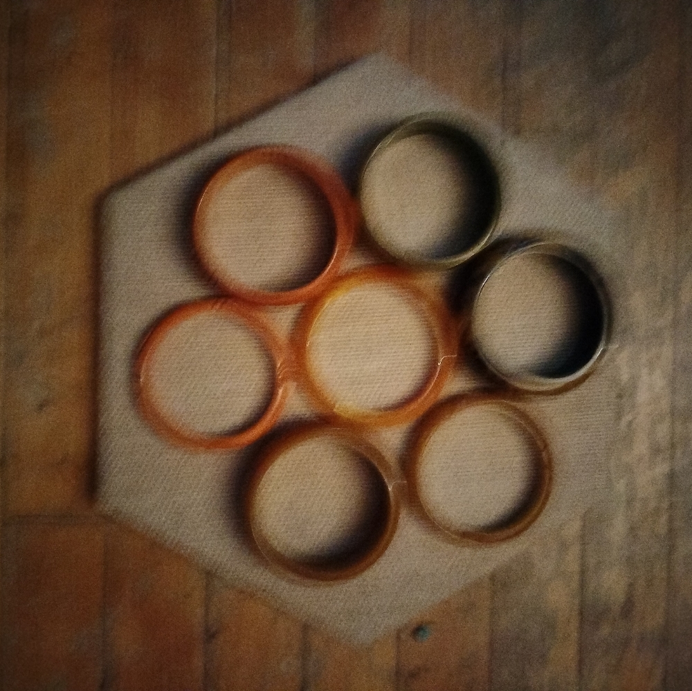 7 vintage bakelite bangles, some are carved